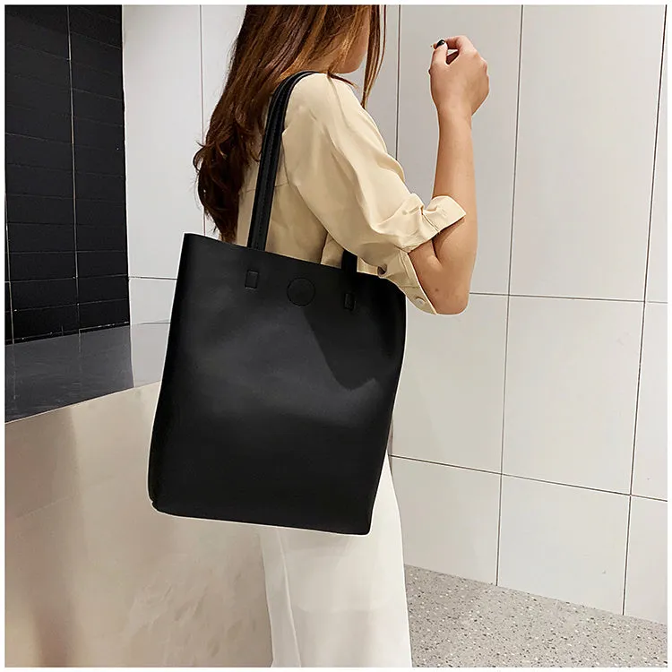 Large-capacity portable tote bag in Black with plain car suture design, soft handle, and single shoulder strap
