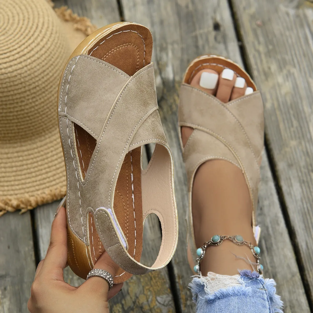 Roman platform sandals with ankle skirt and adjustable Velcro straps in a khaki colour.