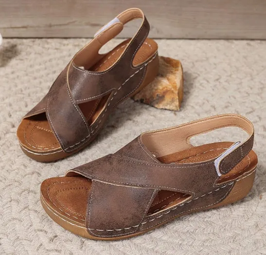 Roman platform sandals with ankle skirt and adjustable Velcro straps in a khaki colour.