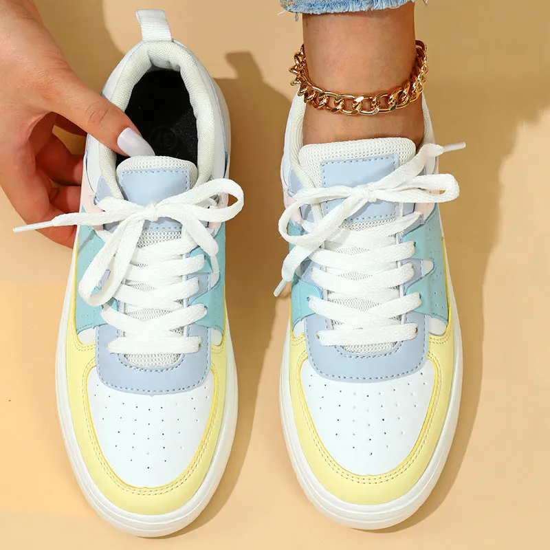 Trendy platform sneakers in white and yellow with breathable mesh upper, lace-up closure, and mid heel sole
