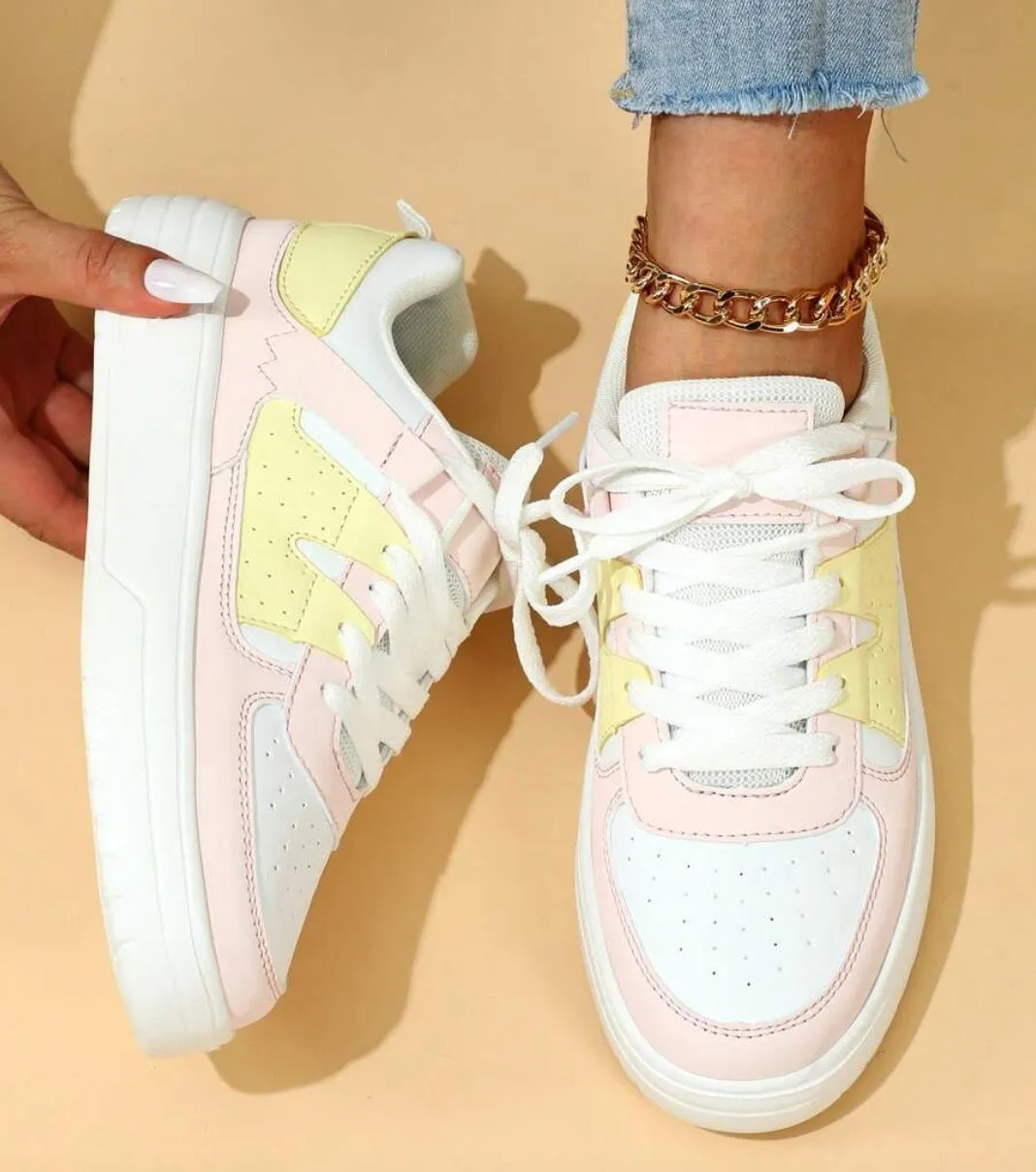Trendy platform sneakers in white and yellow with breathable mesh upper, lace-up closure, and mid heel sole