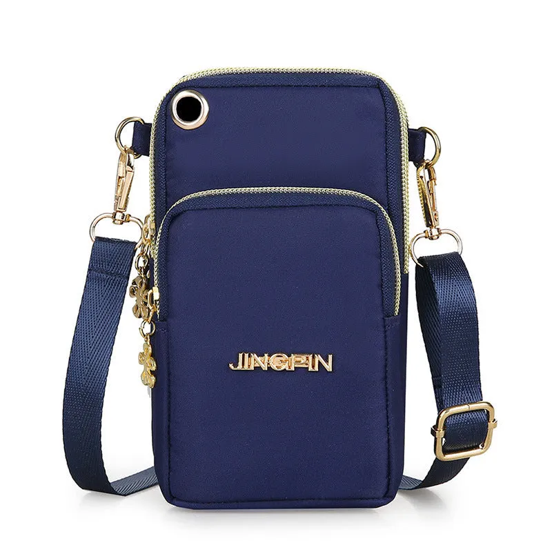 Nylon crossbody mobile phone bag with three zippered layers, card slots, and an adjustable strap in black