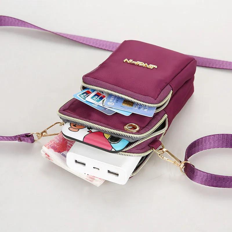 Nylon crossbody mobile phone bag with three zippered layers, card slots, and an adjustable strap in black