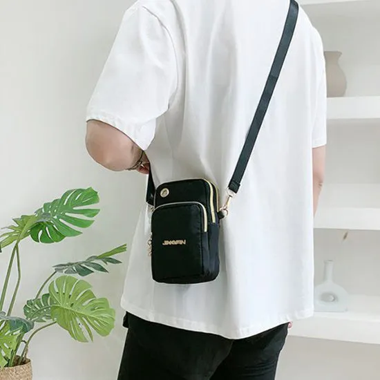 Nylon crossbody mobile phone bag with three zippered layers, card slots, and an adjustable strap in black