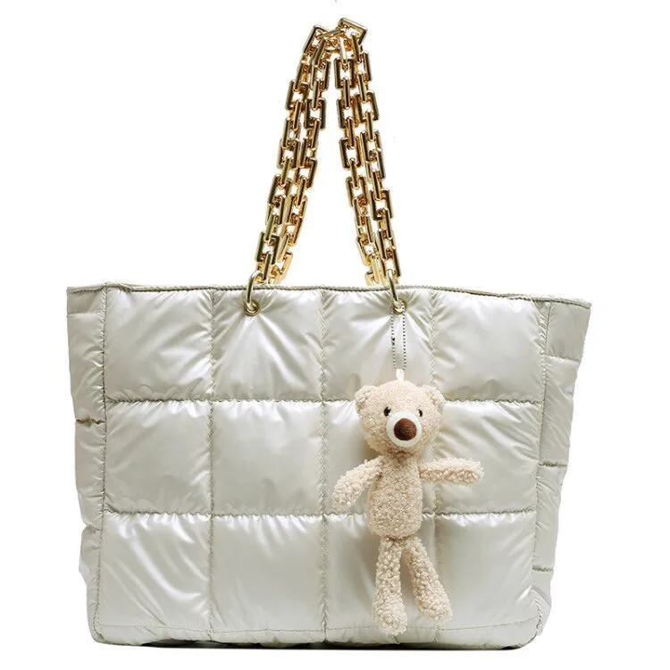Thick chain tote bag for women in black with zipper closure and single shoulder strap, vertical shape