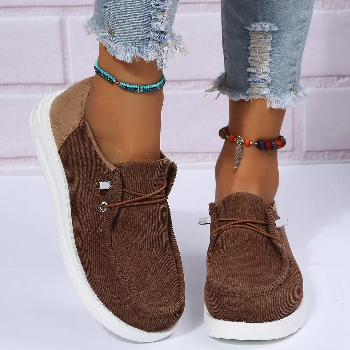 Women's flat shoes in beige with breathable cloth upper, elastic band, round toe, and low heel