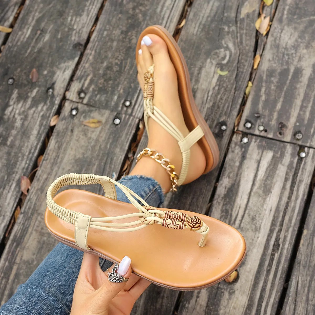 New women's flat sandals in beige with PU upper and hollow design