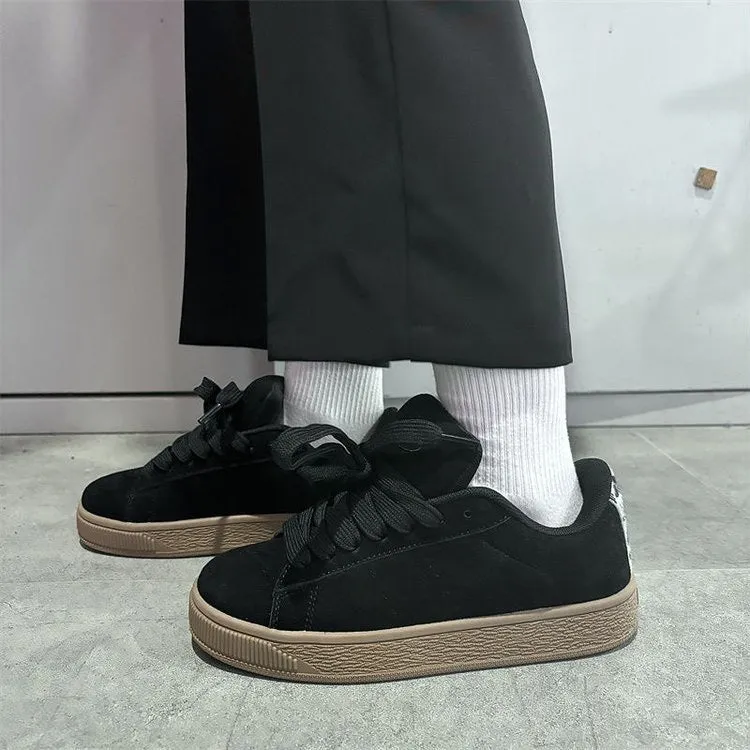 Black retro low-top sneakers with waterproof platform sole and round toe design