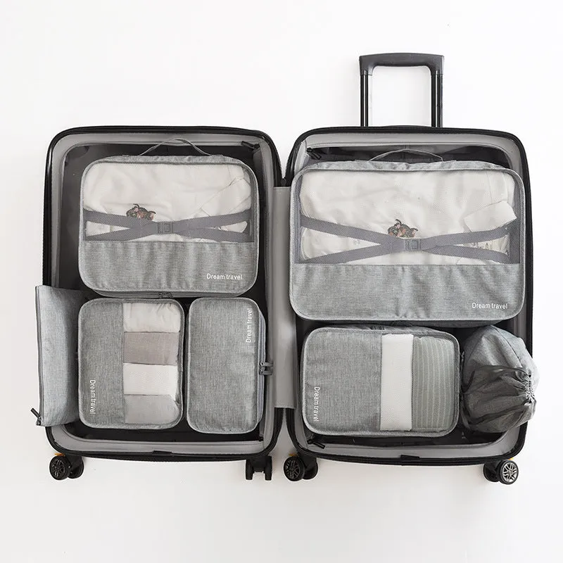 Set of 7 waterproof nylon travel tote bags in black, gray, dark blue, blue, and orange showing different sizes
