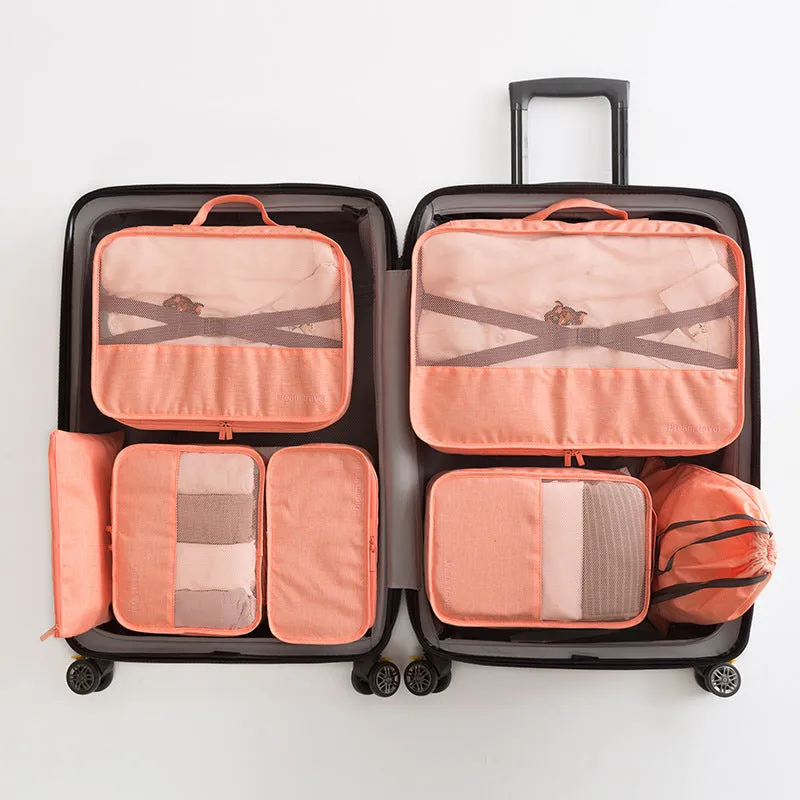 Set of 7 waterproof nylon travel tote bags in black, gray, dark blue, blue, and orange showing different sizes