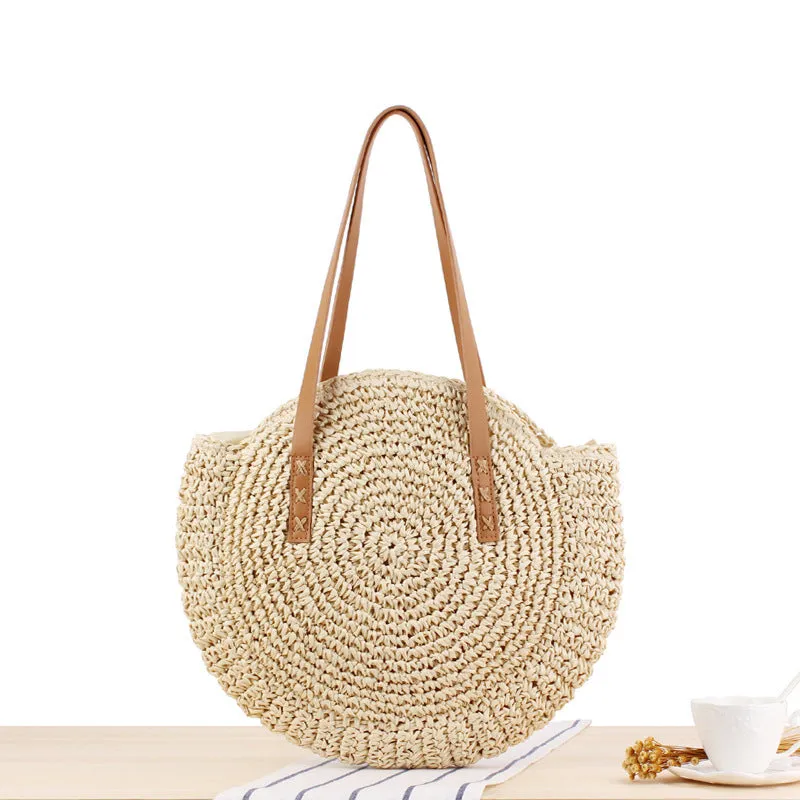 Medium beige straw round shoulder bag with woven finish and zip closure