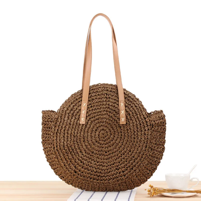 Medium beige straw round shoulder bag with woven finish and zip closure