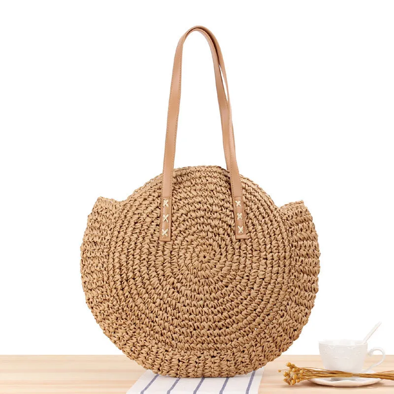 Medium beige straw round shoulder bag with woven finish and zip closure