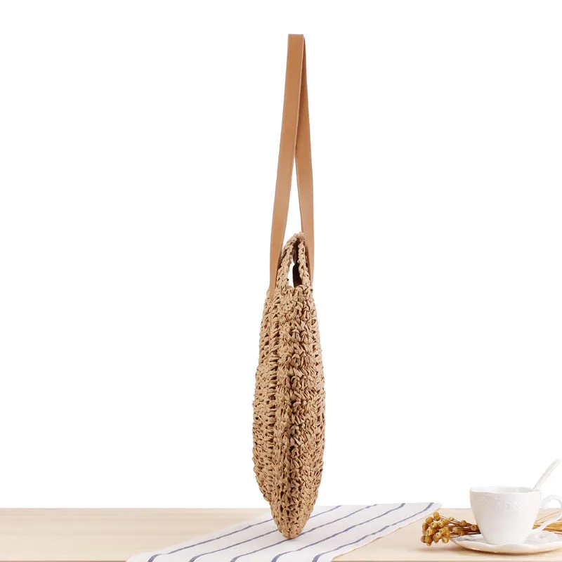 Medium beige straw round shoulder bag with woven finish and zip closure
