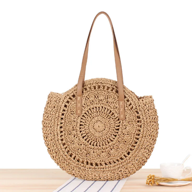 Medium beige straw round shoulder bag with woven finish and zip closure