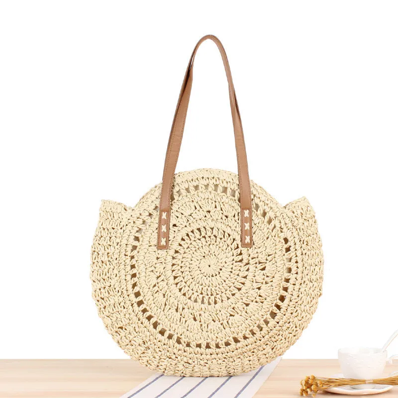 Medium beige straw round shoulder bag with woven finish and zip closure