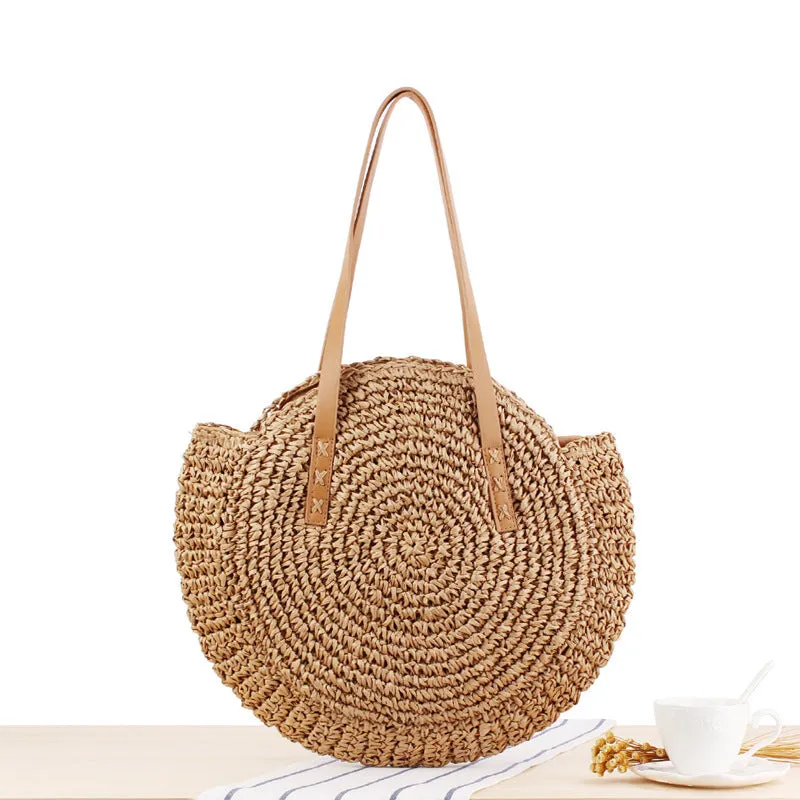 Medium beige straw round shoulder bag with woven finish and zip closure