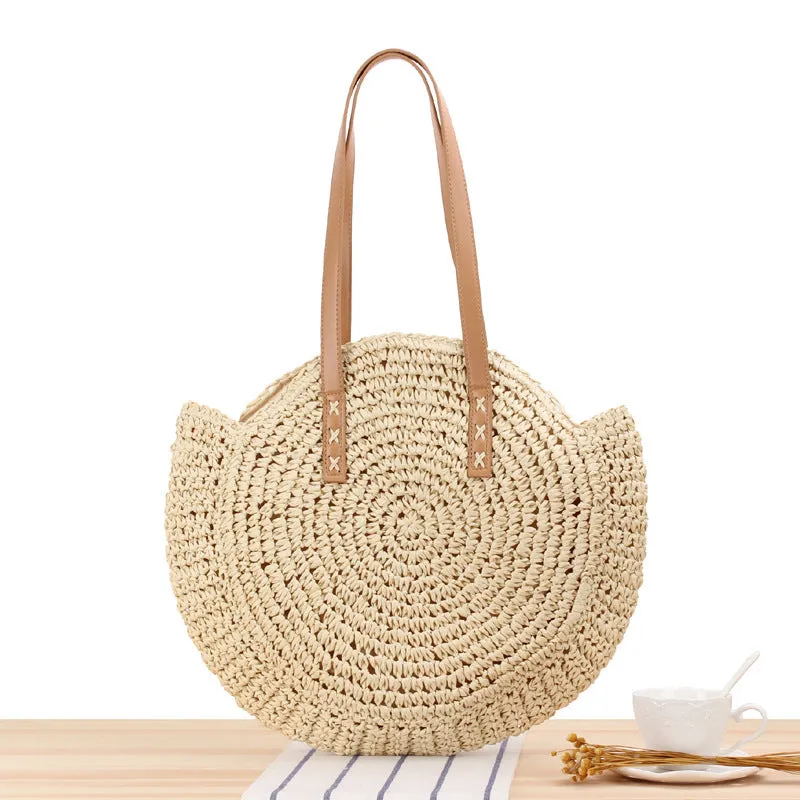 Medium beige straw round shoulder bag with woven finish and zip closure