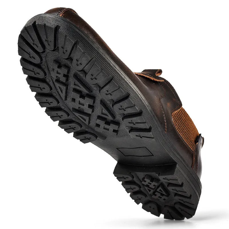 Men's black cowhide leather round toe loafers with rubber sole on a light background