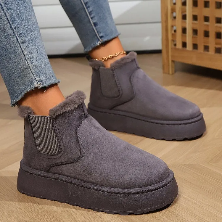 Women's winter snow boots in round toe style with thick rubber sole, cotton fabric upper, and velvet inner lining