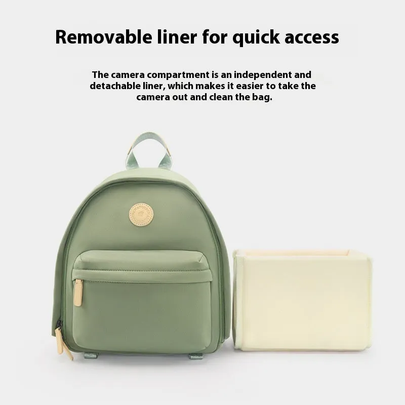 Green polyester shoulder camera bag for women with a curved strap and front patchwork panel.