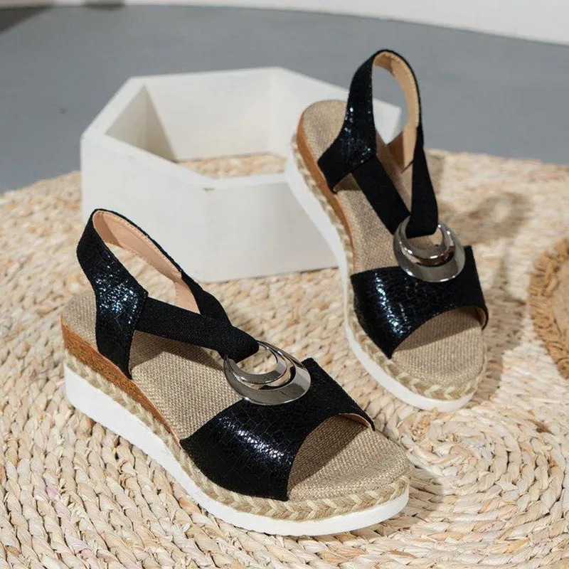 Women's peep toe serpentine wedge sandals, PU upper, in dark brown, shown on foot