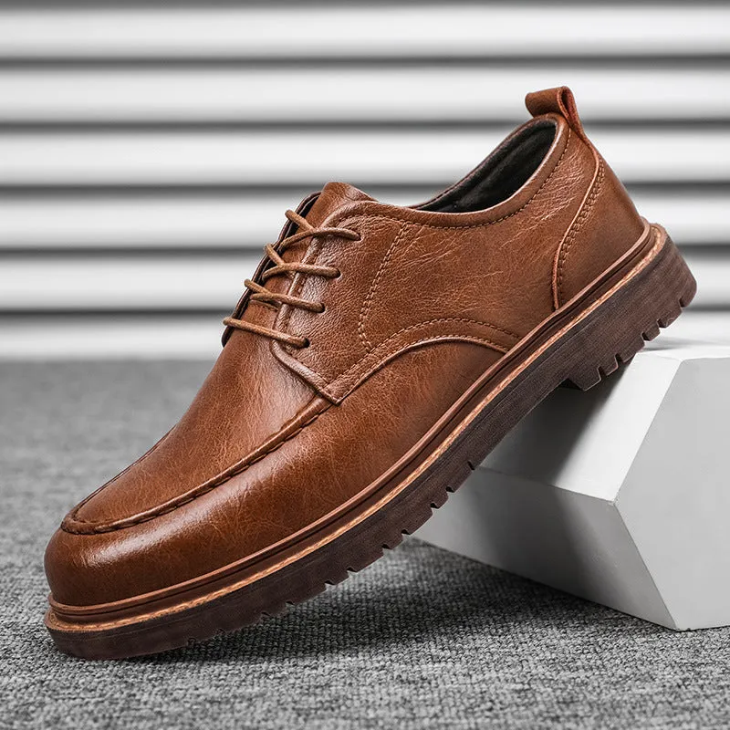 Brown low-top casual leather shoes with round toe and flat rubber sole on a white background.