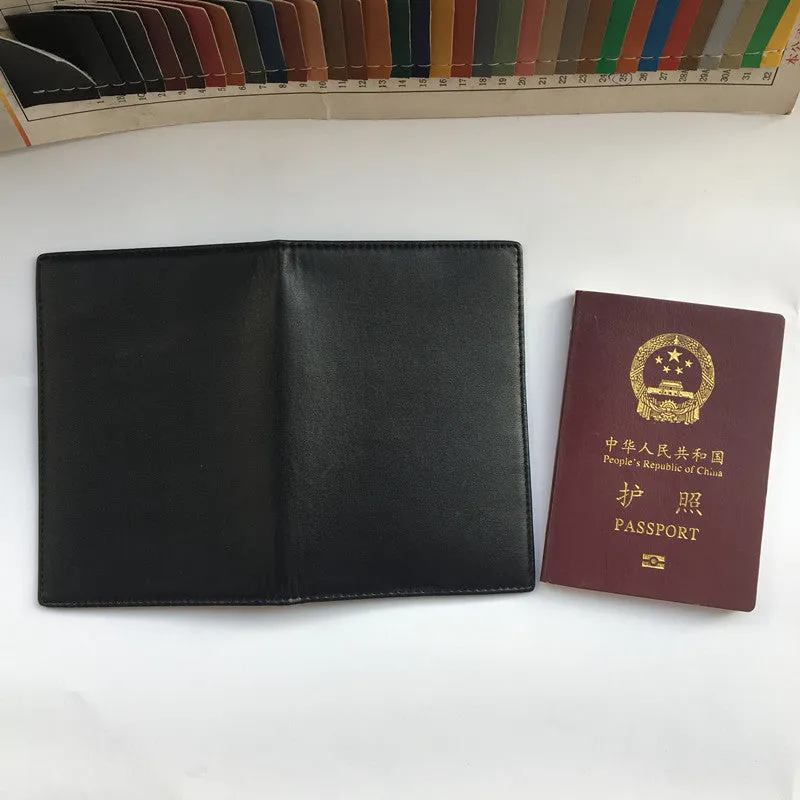Black RFID antimagnetic passport holder made of genuine leather, open showing card slots and passport slot, 15cm long.