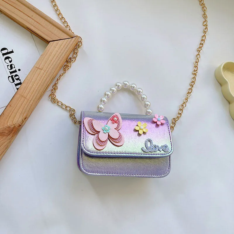 Children's small PU leather shoulder bag with letter print in rose red, showing zipper closure and multiple internal slots