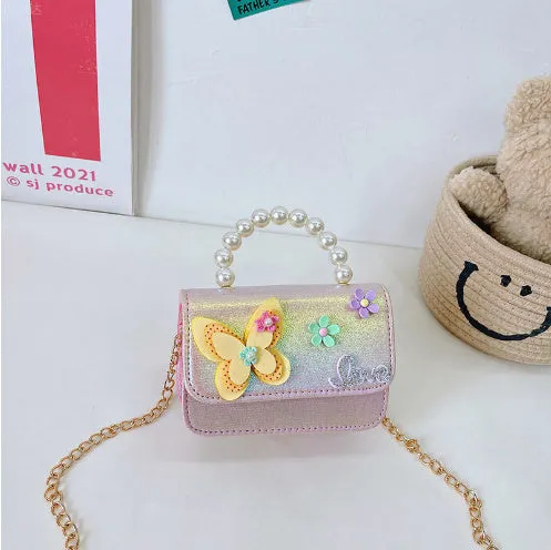 Children's small PU leather shoulder bag with letter print in rose red, showing zipper closure and multiple internal slots