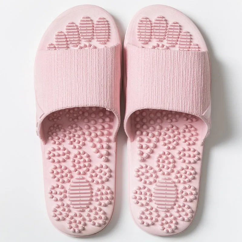 Pair of reflexology foot massage slippers with 3D acupressure particles, blue colour, on a light background