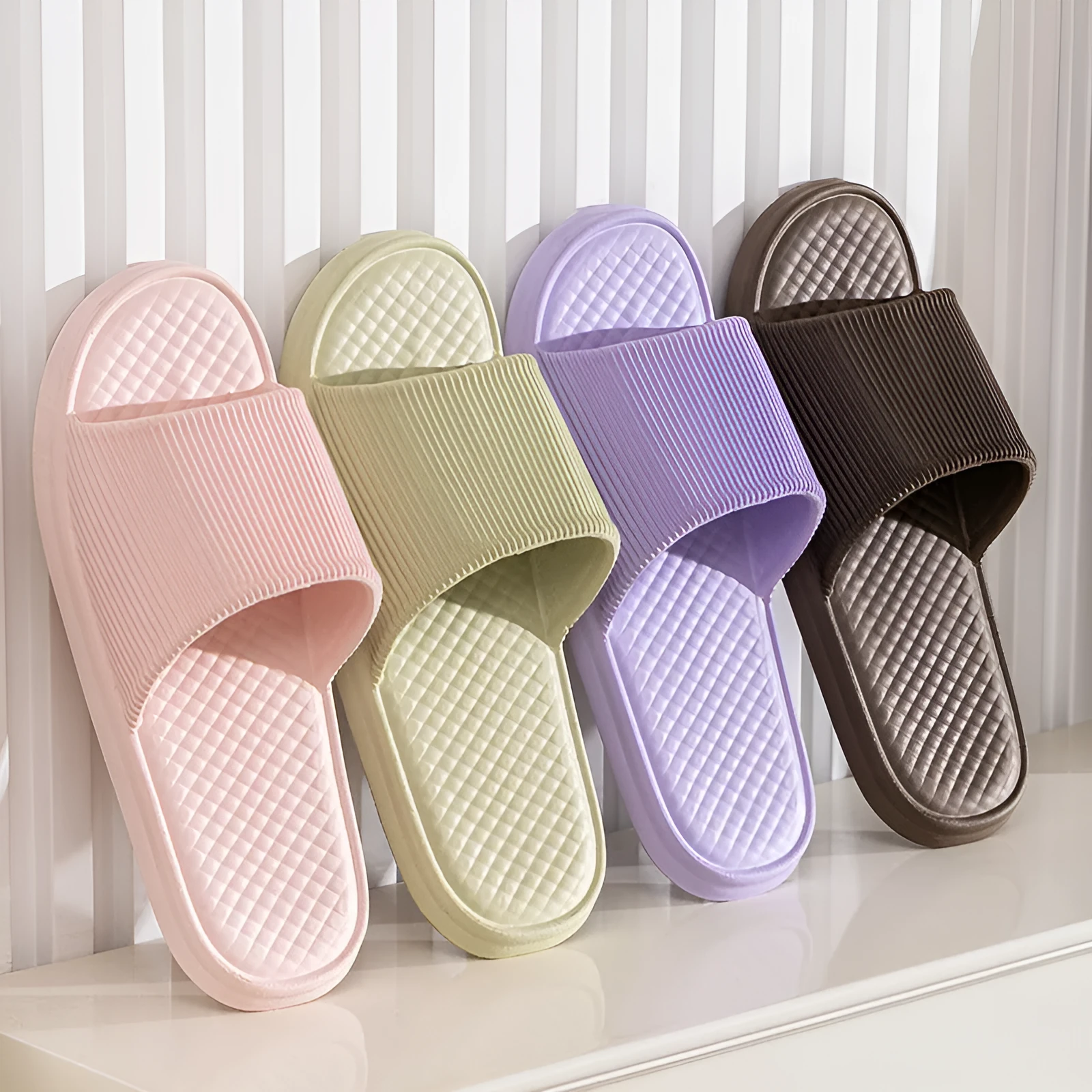 Pair of solid colour rhombus striped non-slip EVA foam indoor slippers
