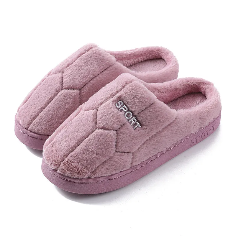 Unisex plush house slippers with white honeycomb-patterned PVC sole, showing round toe and plush inner lining in purple colour