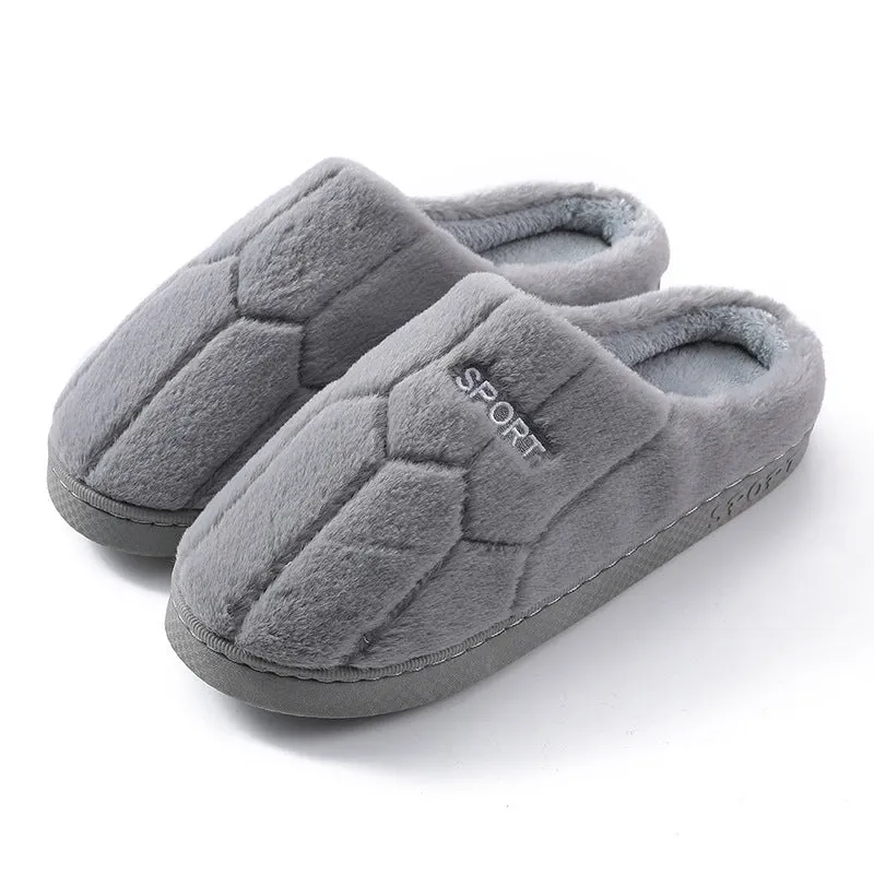 Unisex plush house slippers with white honeycomb-patterned PVC sole, showing round toe and plush inner lining in purple colour