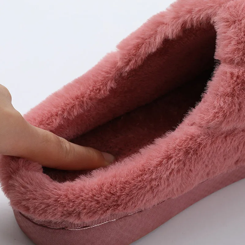 Unisex plush house slippers with white honeycomb-patterned PVC sole, showing round toe and plush inner lining in purple colour