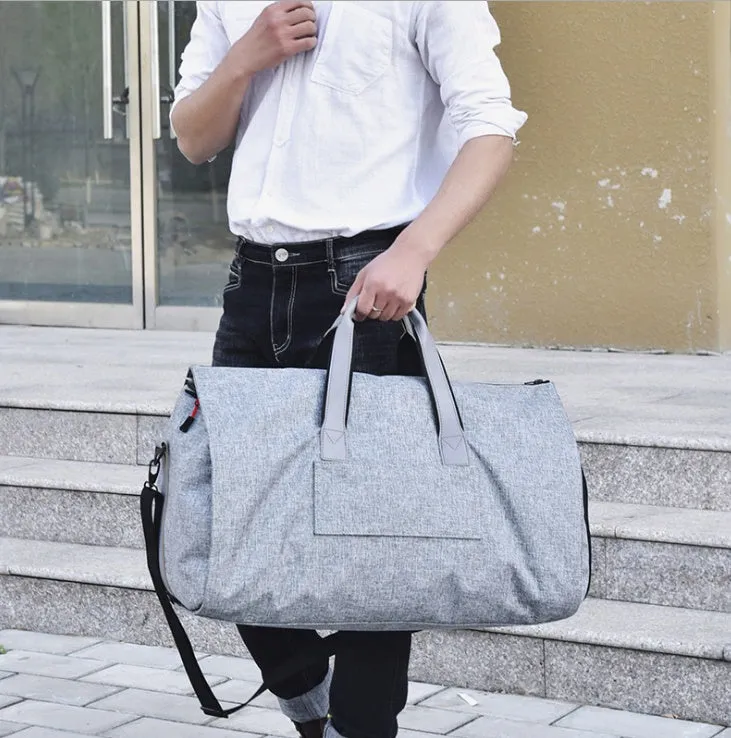 Oxford cloth travel garment bag in black with visible sewing thread details and oval shape