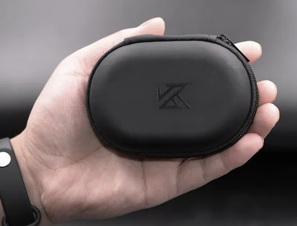 Black soft leather oval-shaped earphone storage bag.