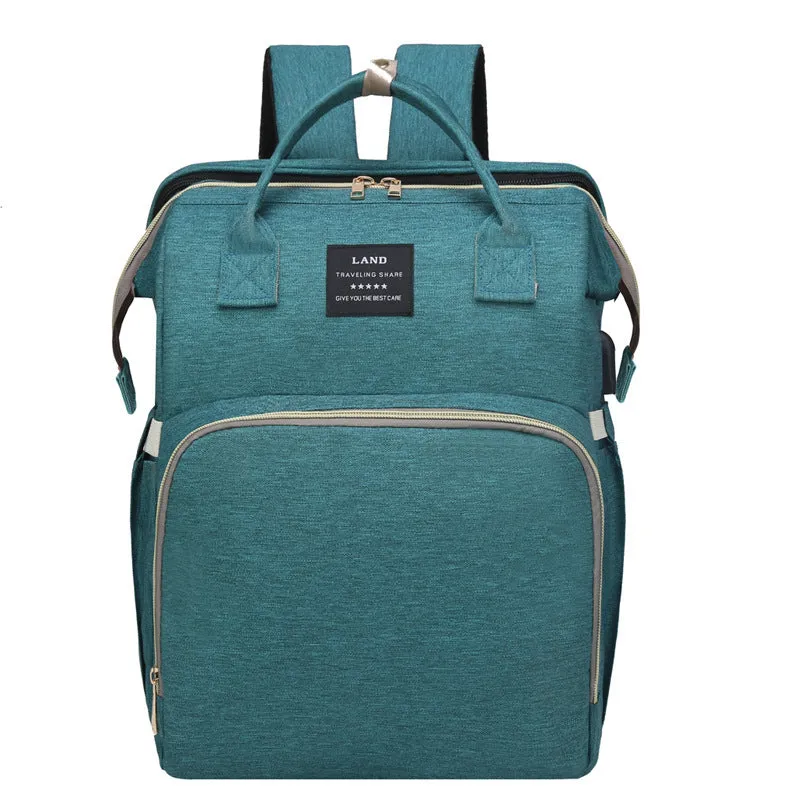 Multifunctional maternity diaper backpack with removable foldable crib in green Oxford fabric