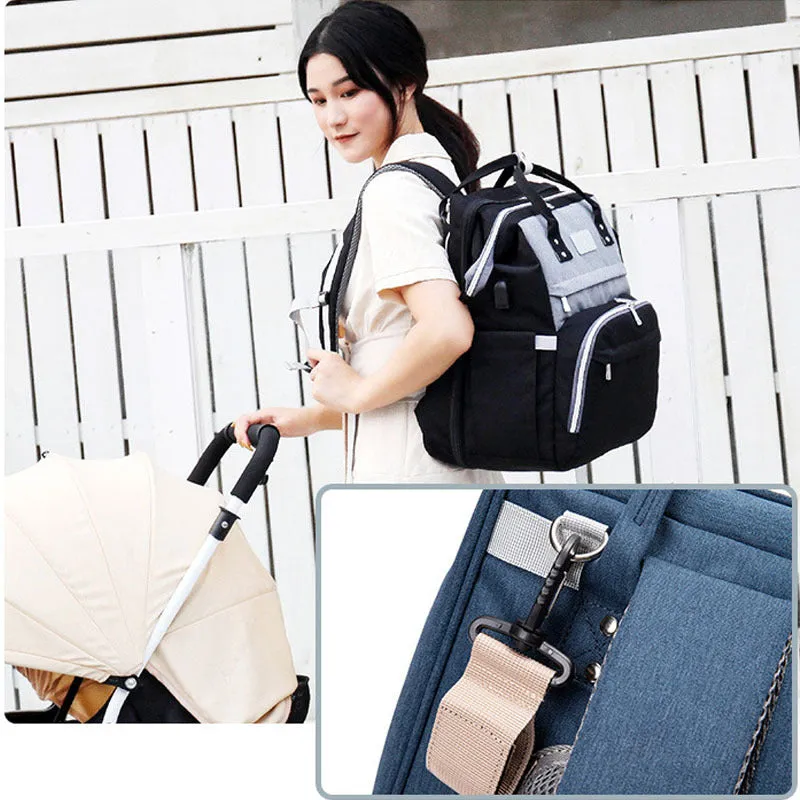 Multifunctional maternity diaper backpack with removable foldable crib in green Oxford fabric