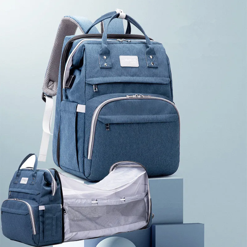 Multifunctional maternity diaper backpack with removable foldable crib in green Oxford fabric