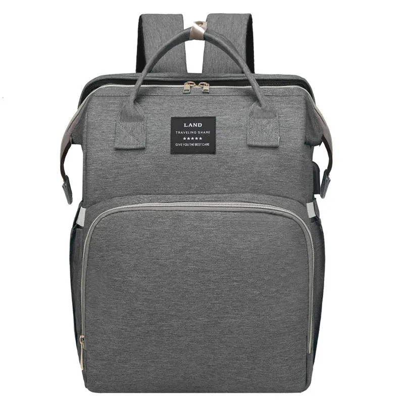 Multifunctional maternity diaper backpack with removable foldable crib in green Oxford fabric