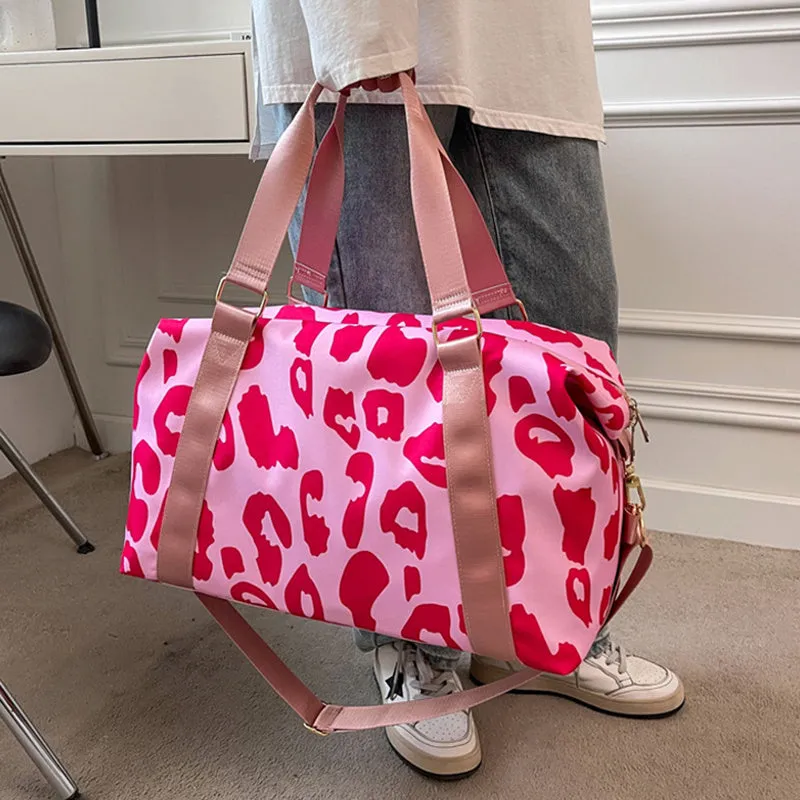 Women's large travel duffel bag with cow pattern, black, showing zippered main compartment and soft handle
