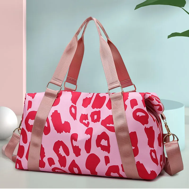Women's large travel duffel bag with cow pattern, black, showing zippered main compartment and soft handle