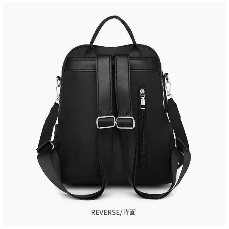 Soft black PU backpack with large main compartment and front organisational pockets
