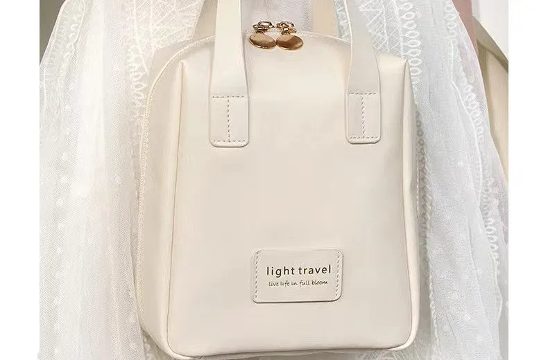 Shell shape PU leather waterproof cosmetic bag in milk apricot white with metal zipper