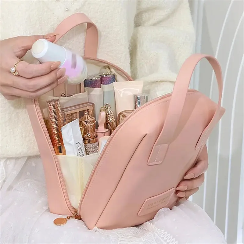 Shell shape PU leather waterproof cosmetic bag in milk apricot white with metal zipper