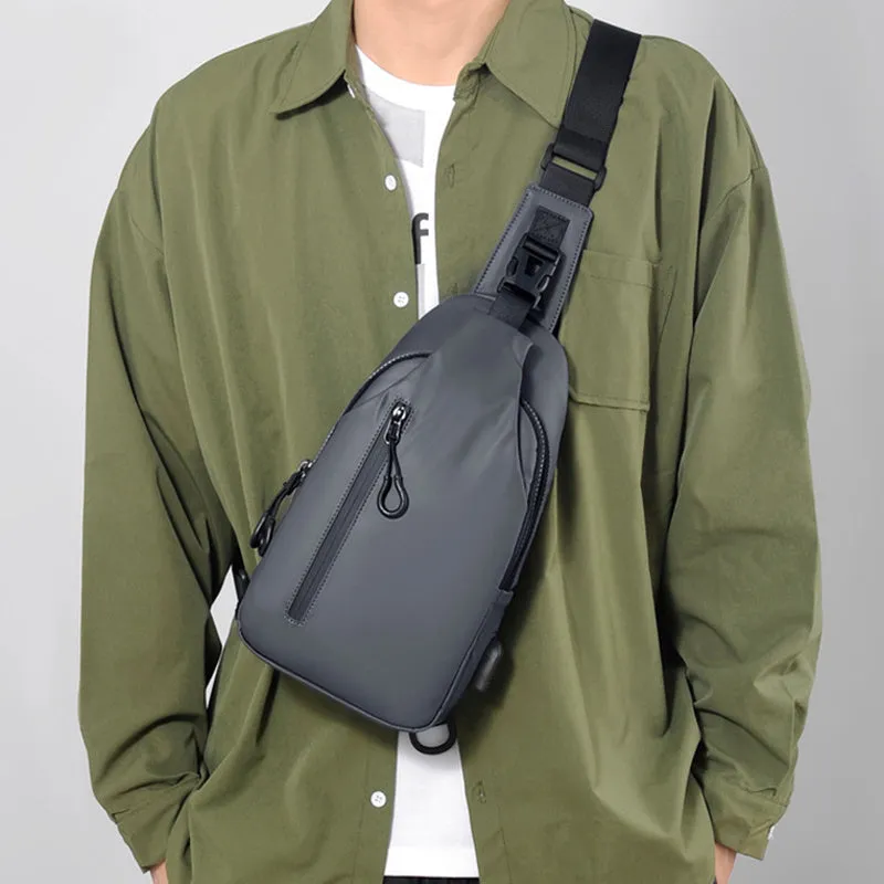 Black sling crossbody backpack for men with zipper and polyester lining, vertical square shape, solid colour design