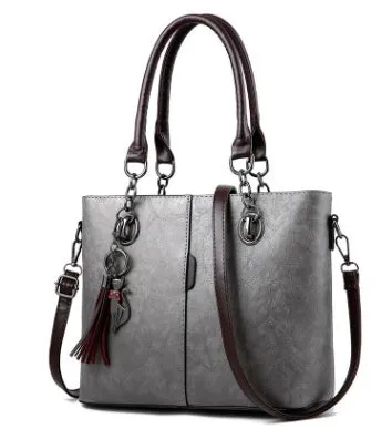 Large black PU leather women's shoulder bag with zipper top, handle drop 20cm, plain casual style.