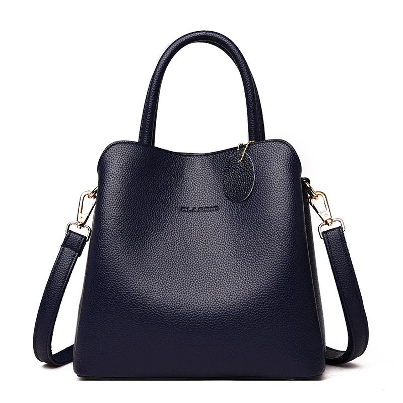 Ya Shi Mei Duo women's medium PU leather bucket bag with litchi pattern in black, soft handle and zipper closure