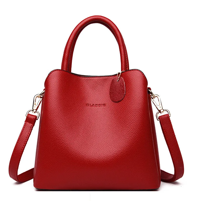 Ya Shi Mei Duo women's medium PU leather bucket bag with litchi pattern in black, soft handle and zipper closure